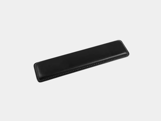 Orgemy PU leather keyboard wrist rest pad on a minimal desk setup