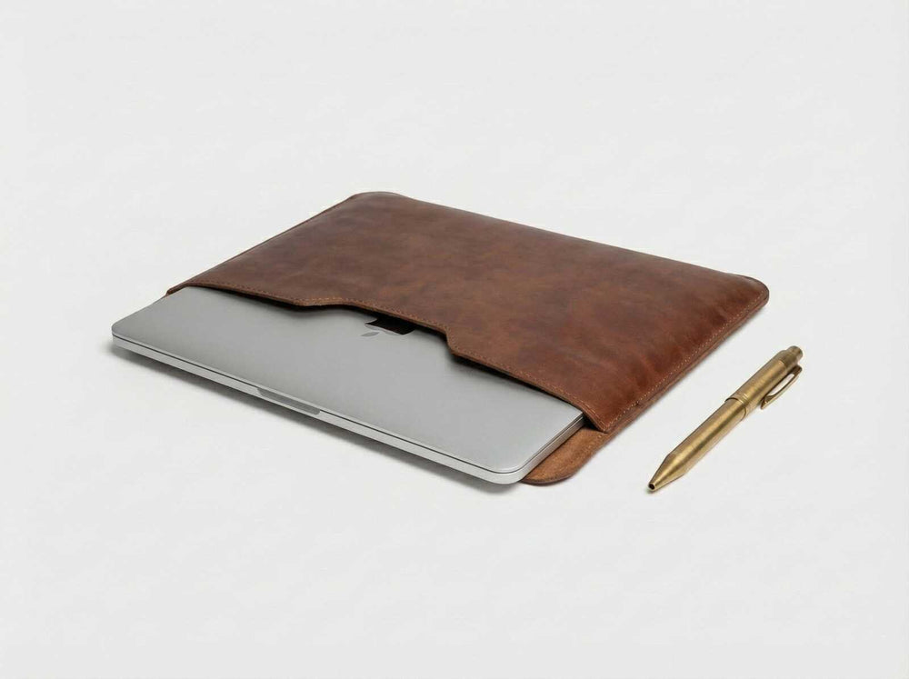 MacBook Pro 15 inch inside a slim leather laptop pouch by Orgemy.