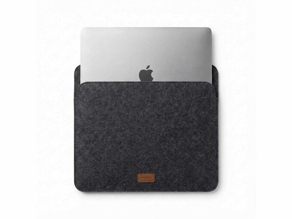 Orgemy grey felt laptop sleeve with MacBook inserted, showing snug fit.