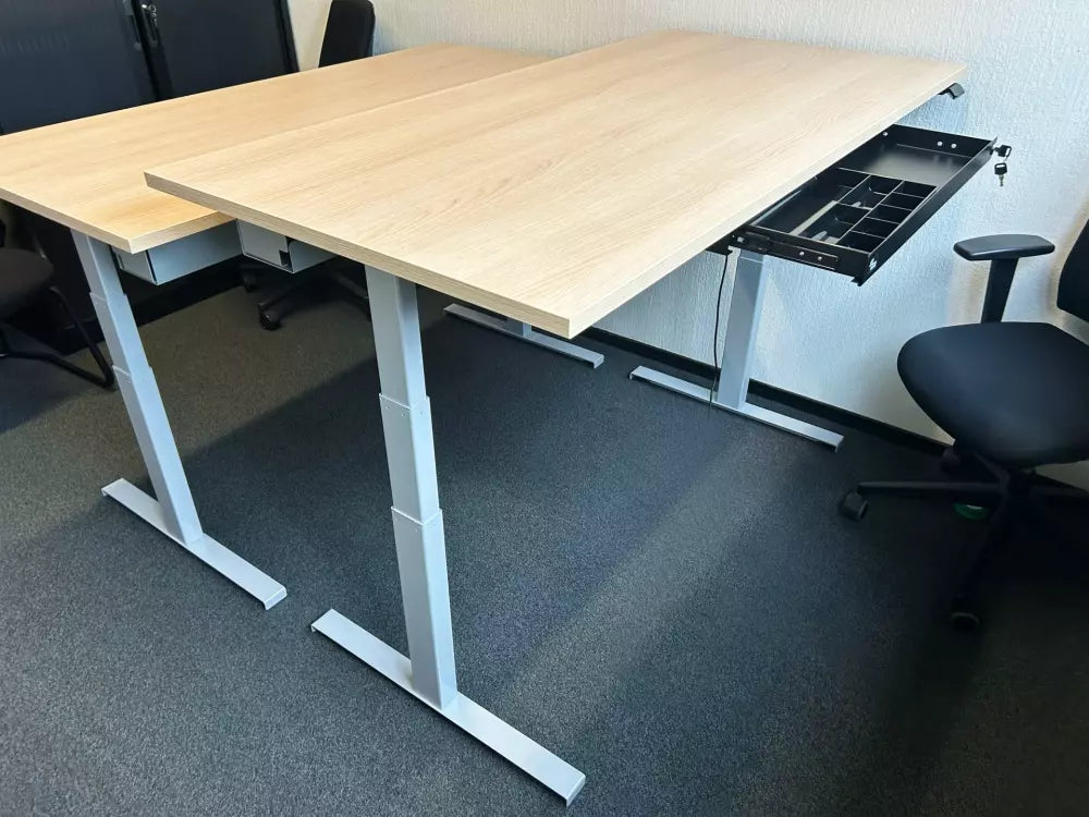 Light wood standing desk with two Orgemy wide 29" drawers installed underneath.