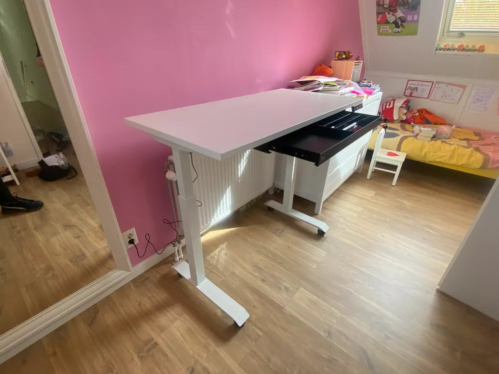 Light wood standing desk with two Orgemy wide 29" drawers installed underneath.