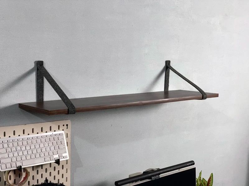 Side view of felt shelf holder showing minimalist mounting style.